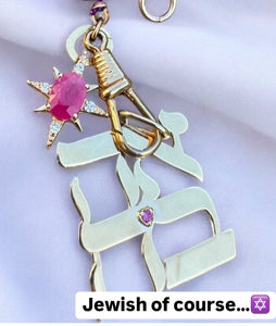 Large gold plated pendant with pink sapphire